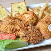 4 piece Fried Chicken Dinner · Includes a leg, wing, thigh, and chicken breast. It also comes with fries and bread as a side.