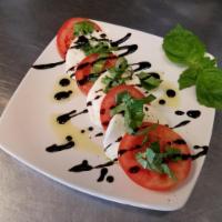 Caprese · Fresh mozzarella cheese, sliced Roma tomatoes, extra virgin olive oil and basil, drizzled wi...