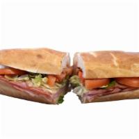The Hammingway Sandwich · Black Forest ham, Swiss cheese, lettuce, tomato and Dijon mayonnaise. Baked in our wood fire...