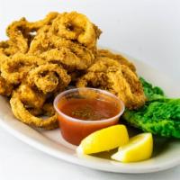Calamari Appetizer · Lightly dusted with our secret blend of flour and seasoning then fried until crisp or grille...