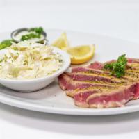 Ahi Tuna · Prepared Cajun style or with lemon herb seasoning. Seared on both sides with a rare center.