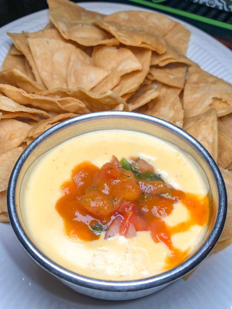 Chef's Queso · Fresh made spicy cheese sauce and fresh cut pico de gallo and served with house made corn tortilla chips.