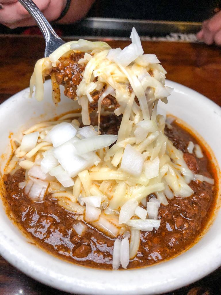 Grass Fed Beef Chili · Grass fed beef and pinto beans with a perfect blend of fresh poblano and chipotle peppers topped with Jack cheese and diced onions.