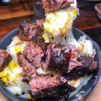 Butcher Bowl burnt ends · Burnt Ends, Mashed potatoes, fresh corn and Jack cheese topped with choice of meat.