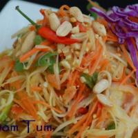 14. Som Tom Salad · Papaya salad. Green papaya, carrot, green beans, dried shrimp, tomatoes, peanuts, chili and ...