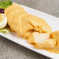Papa a la Huancaina · Steamed potatoes smothered in our yellow creamy cheese sauce slightly spiced with a hint of ...