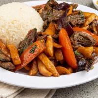 Lomo Saltado Tayta · Strips of flap meat sauteed in soy sauce, sesame oil, tomatoes, onions, and french fries wit...