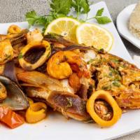 Whole Steamed Snapper with Seafood · Steamed red snapper in our fish stew made up to tomato, onions and spices with seafood. Come...