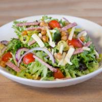 Italian Chop Salad · Spring mix, salami, provolone, pepperoncini, fried chickpeas, red onion, heirloom grape toma...