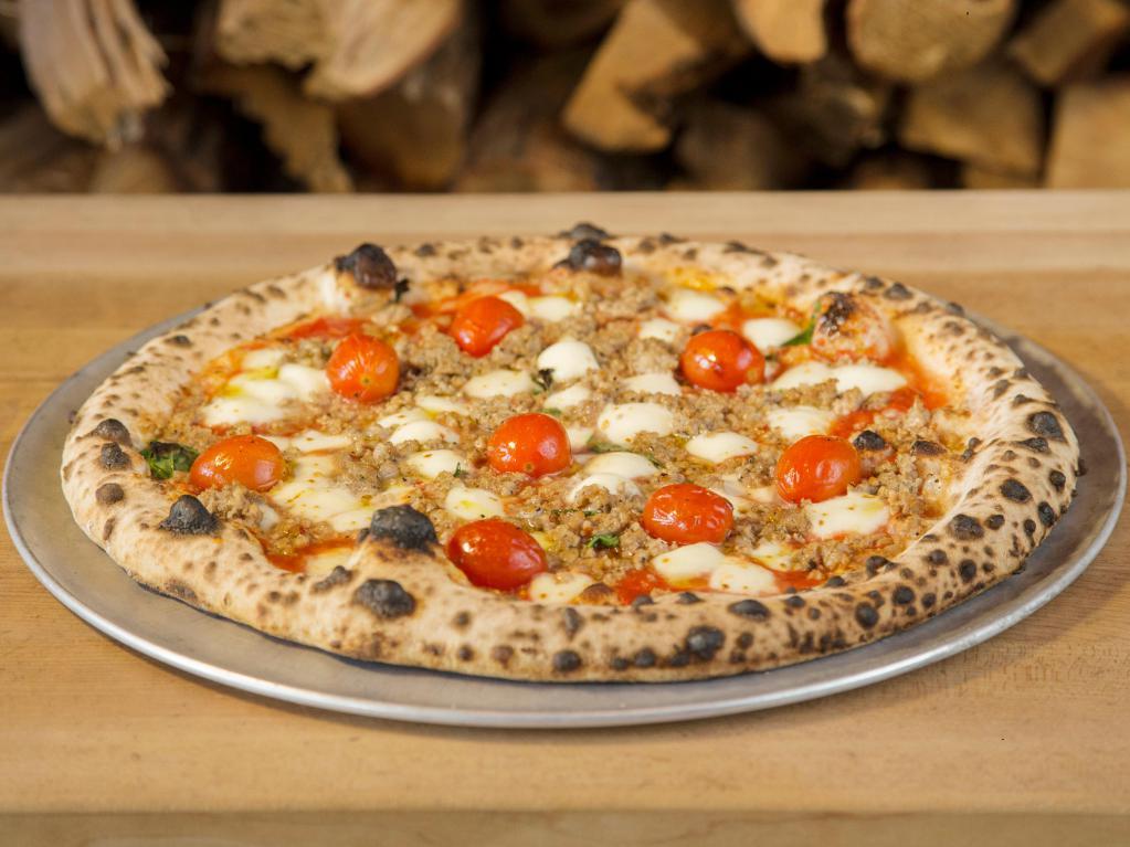 Tuscan Village Pizza · Fresh mozzarella, Italian sausage, roasted cherry tomatoes, and sauce.