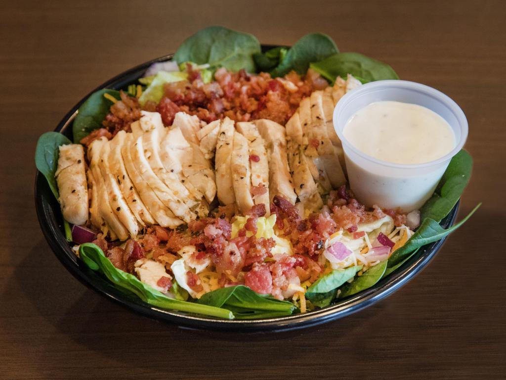 Chicken Coop Salad · 3 leaf blend, cheddar jack cheese, bacon, grilled chicken and red onions served with ranch dressing.