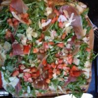 Prosciutto Pizza with Arugula · Italian cheese, shaved Parmesan and arugula and tomatoes and red wine vinaigrette.