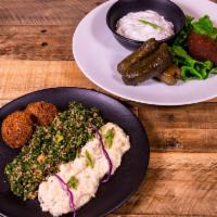 Mona Special · For two. Hummus, baba ghanouj, grape leaves, tabouli, falafel, kibby and lebna.
