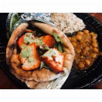 20. Chicken Kabob Gyro · Wrapped in fresh naan, lettuce, tomato, onions and our green chutney, served with rice and c...