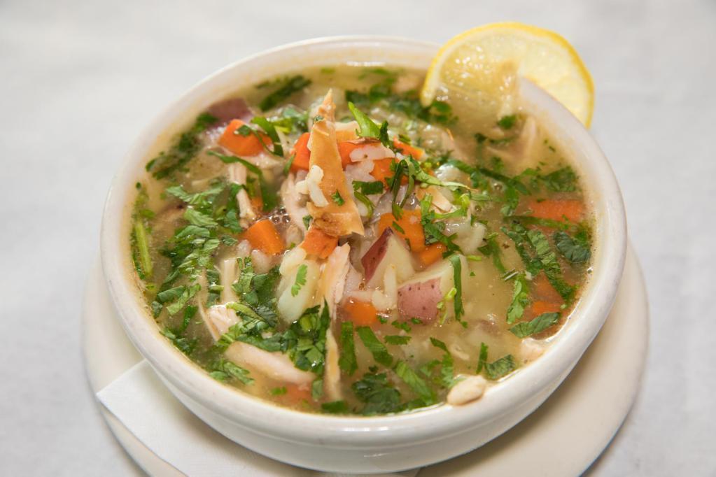 Chicken Soup · Bone-in chicken with chicken stock, potatoes, carrots, rice and just the right herbs.