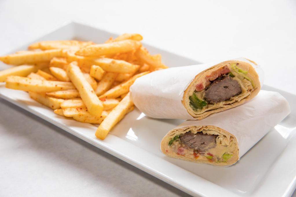 Beef Kabob Pita Wrap · Beef kabob with hummus, tomatoes, onions and parsley, served with its own distinctive dressing.