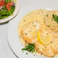 Cream Lemon Chicken · Pan fried chicken breast filet served in a creamy lemon sauce. Served with Gaby's house sala...
