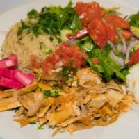 Chicken Shawarma · Slices of marinated chicken slowly cooked on an upright spit. Served with Gaby's house salad...