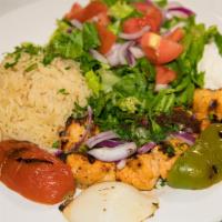 Chicken Kabob · Two skewers of grilled marinated chicken kabob. Served with Gaby's house salad and rice. 