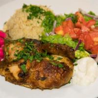 Rotisserie Chicken · Half a rotisserie chicken in our special seasonings. Served with Gaby's house salad and rice. 
