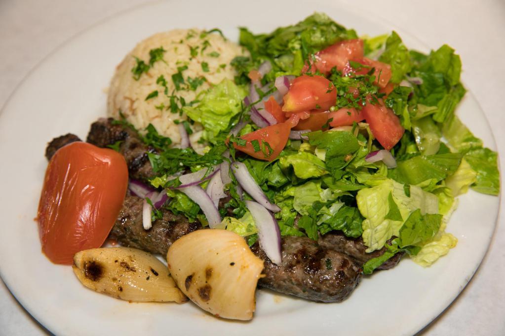 Kafta Kabob · Two skewers of grilled seasoned ground beef and lamb mixed with chopped parsley, onion and spices. Served with gaby's house salad and rice. 