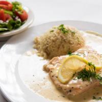 Creamy Lemon Salmon · Pan fried salmon fillet served in a creamy lemon sauce. Served with Gaby's house salad and r...