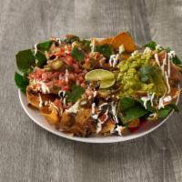 Fiesta Nachos · Chips with cheese and a variety of toppings. Add meat for an additional charge.