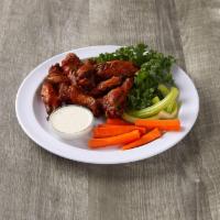Ranchero Chicken Classic Wings · Cooked wing of a chicken coated in sauce or seasoning.