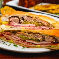 Cubano Sandwich · The classic. Baked ham, salami, roast pork, Swiss cheese, mustard or mayo.