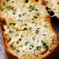Cheese Garlic Bread · Buttery bread that is topped with garlic.