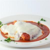 Veal Parmigiana · Breaded & baked, mozzarella cheese and marinara sauce.