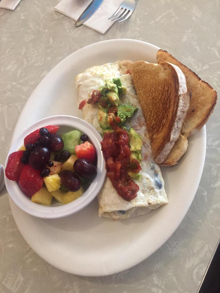 Narragansett Omelette · Grilled chicken, avocado, tomato and american cheese. Prepared with 3 large eggs and served with home fries and choice of toast.
