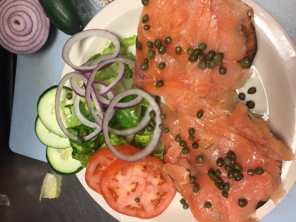 Lox Platter · Smoked salmon served on a bagel with lettuce, tomato, cucumbers, red onions and capers.