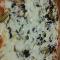 The Veggie Pizza · Fresh mushrooms, green peppers, fresh tomatoes, black olives, white onions, fresh zucchini a...