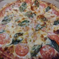 Margherita Pizza · Fresh tomatoes, fresh basil, fresh garlic and extra cheese.