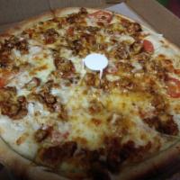Barbecue Chicken Designer Pizza · Chicken, fresh tomatoes, white onions, and barbecue sauce on a ranch base