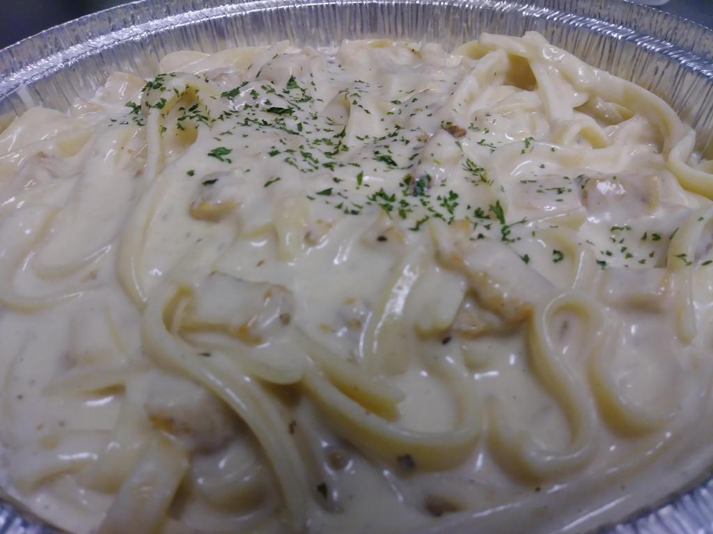 Chicken Fettuccine Alfredo · Pasta comes with side salad and garlic Knots