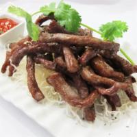 Thai Beef Jerky (8 oz) · Fried marinated beef strips served with spicy sriracha sauce.