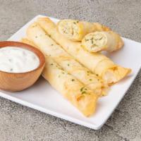 Cigar Roll · Lightly fried phyllo dough filled with feta and parsley.