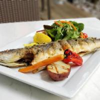 Mediterranean Sea Bass · Char grilled sea bass served with caper sauce, mixed green salad and grilled potato.