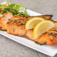 Grilled Salmon · Seasoned Atlantic salmon served with mixed green and baked potato.