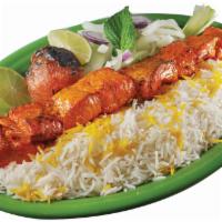 Jojeh Kabob · Chicken with bones marinated in seasonings and saffron, grilled to perfection. Served with p...