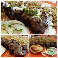 Beef Tikka Kabob · Tender chunks of marinated meat grilled to perfection on skewers. Served with pita bread and...
