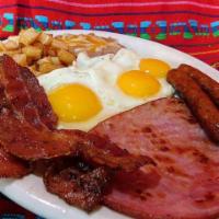 C. Tio Borrachos Big Breakfast · 3 eggs, papas, beans, ham, sausage and bacon.
