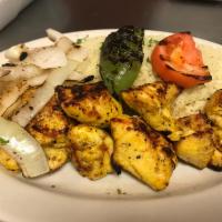 Chicken Kabob Entree · Grilled marinated chicken kabob served with rice, salad, and pita bread.