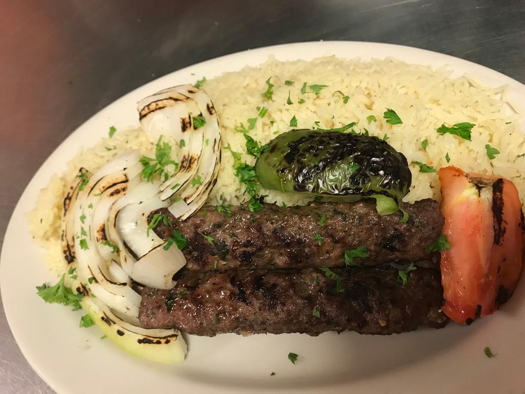 Kafta Kabob Entree · Grilled seasoned ground cuts of tender beef, minced onion, and parsley served with rice, salad, and pita bread.