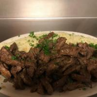 Beef Shawarma Entree · Thin slices of lightly seasoned beef with rice, salad, and pita bread.