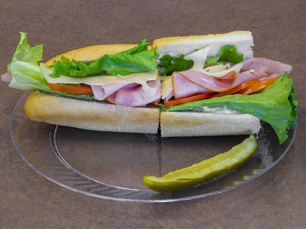 Ham and Swiss Sandwich · Fresh sliced ham, Swiss cheese, lettuce, tomato and homemade mayo in a toasted french roll.