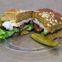 California Club Sandwich · Fresh sliced turkey, Swiss cheese, thick sliced bacon, avocado, tomato, lettuce and homemade...