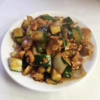 Cashew Nut Chicken · Stir-fried with vegetables topped with cashew nuts.
